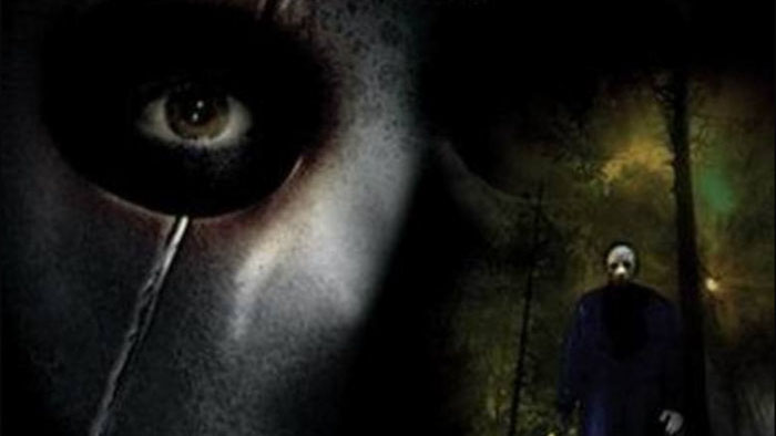 Close-up of a masked killer's eye with a dark forest and ominous figure in the background from the horror film Memorial Day (1999).