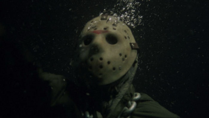Jason Voorhees in a hockey mask submerged underwater and chained at the neck in Friday the 13th Part VI: Jason Lives (1986).