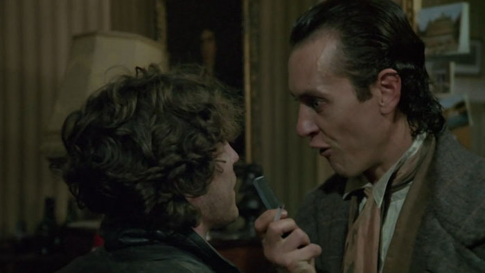 Withnail confronts Marwood with a comb in a tense moment from Withnail and I