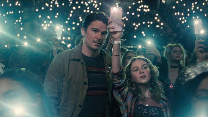 Father and daughter at a pop concert in the thriller film Trap by M. Night Shyamalan