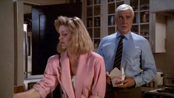 Leslie Nielsen and Priscilla Presley in a kitchen scene from The Naked Gun