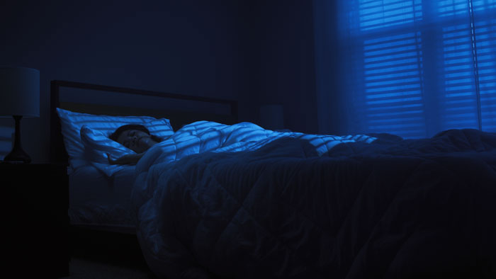 Jennifer sleeping peacefully before the terror begins in Meet Evelyn, My Sleep Paralysis Demon