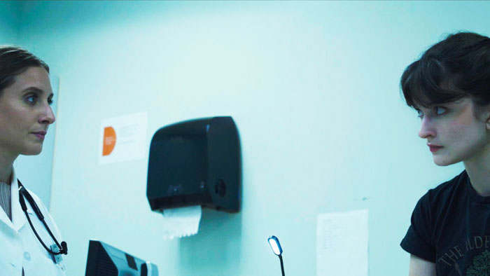 Amy (Hannah Dale) speaks with Dr. McAnnis (Maria Prudente) in a tense clinic scene from No Choice.