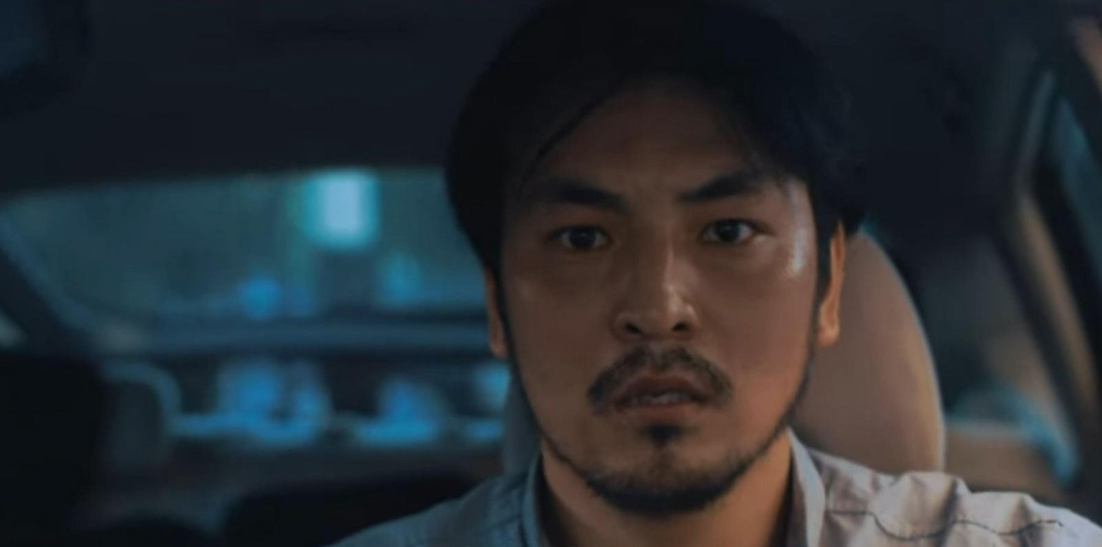 Almaz stares in fear while driving through chaos in The Desperate End