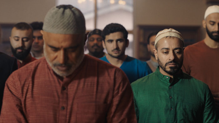 Imam and congregants praying in a mosque from the short film Witness