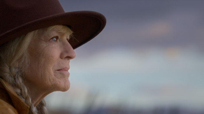 Diane Mahree in profile wearing a wide-brimmed hat in Mountain Girl