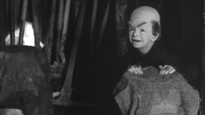 A mole-man creature emerges from hiding in Superman and the Mole-Men (1951)