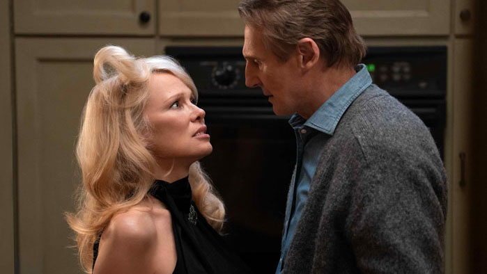 Liam Neeson and Pamela Anderson in an intense scene from The Naked Gun reboot