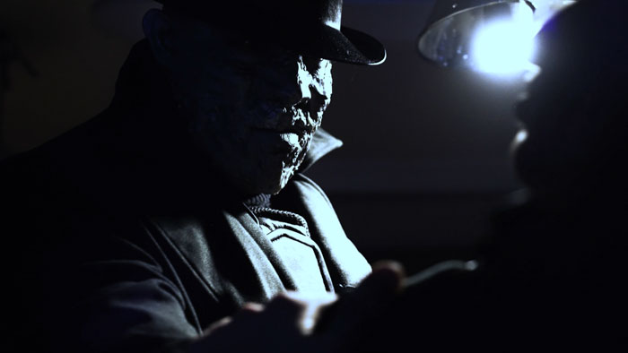 Mr. X looms menacingly in the shadows in Leaving Raccoon City