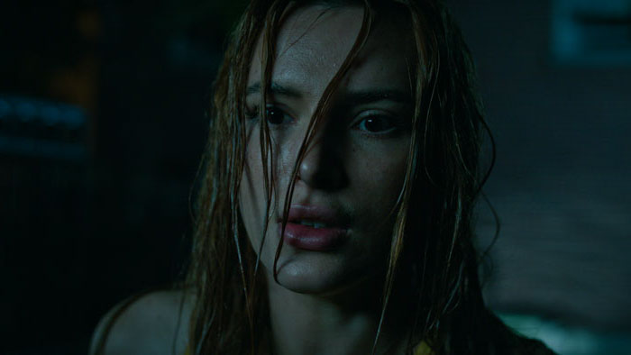 Bella Thorne soaked and intense in a night scene from Saint Clare