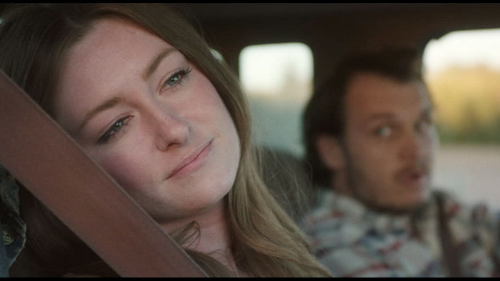 Callie sits in the truck with her father in Gold Hearts of Hot Rod County