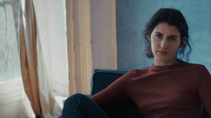 Lucy listens intently in In Transit