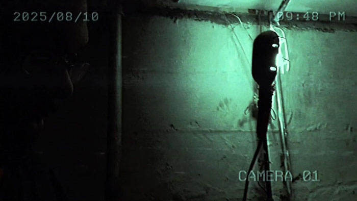 Surveillance-style footage captures the eerie basement in LearX.