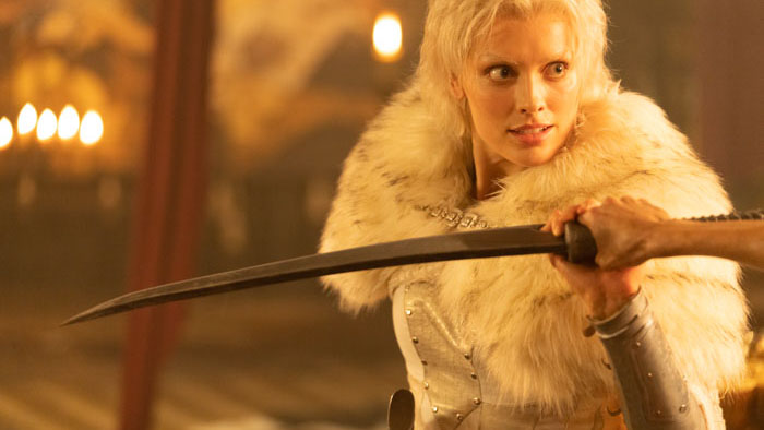 Wallis Day as Annisia holds a sword in Red Sonja