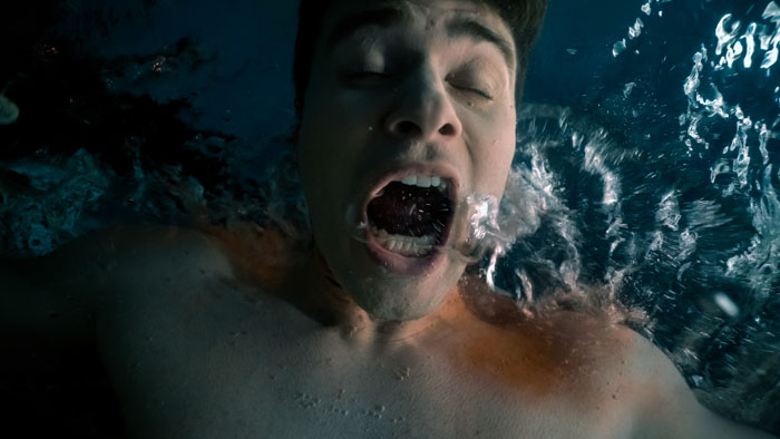 Sam Wexler as Corey struggling underwater in Stalkers