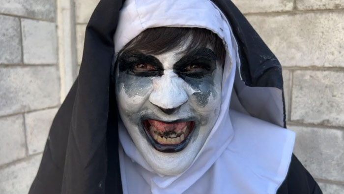 Close-up of Sister Panda, a character in Narco Sharks (Narco Shark 2) dressed as a nun with menacing makeup.