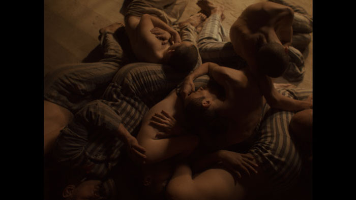 Emaciated prisoner in Auschwitz from Triumph of the Heart