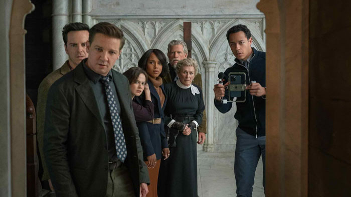 The congregation looks into the church chamber in Wake Up Dead Man: A Knives Out Mystery.