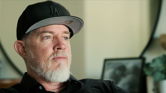 Director Erik Thureson in an interview setting wearing a black LA hat.