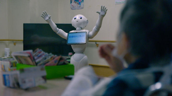 Robot caregiver assisting an elderly person in Japan as shown in Forever Young
