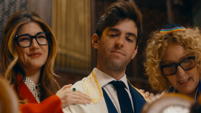 Leo (Jonah Feingold) stands at a synagogue podium during a Bar Mitzvah moment in 31 Candles (2025).