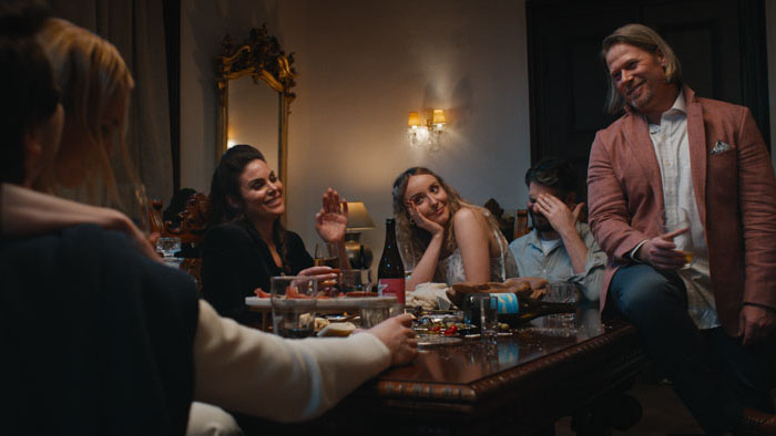 Francesca Carlyle (Joan Collins) and Chauncey react to a discovery on a laptop in A Murder Between Friends.