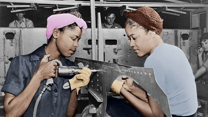 Leudell Mitchell and Lavada Cherry riveting metal panels in a WWII factory.