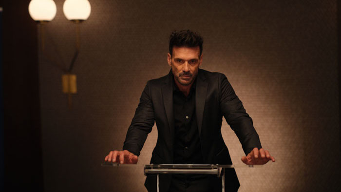 Frank Grillo as David Blume stands at a podium in the neo-noir thriller Misdirection (2026).
