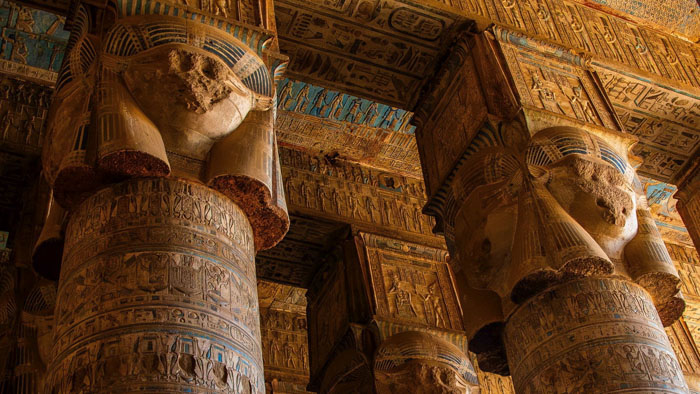 Stylized ancient Egyptian illustration of figures and symbolic deities, representing themes in Out Of Darkness: Heavy Is The Crown Vol. 2 (2026). 