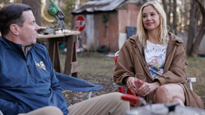 Michael Mosley and Mira Sorvino in a quiet outdoor conversation in Signing Tony Raymond.