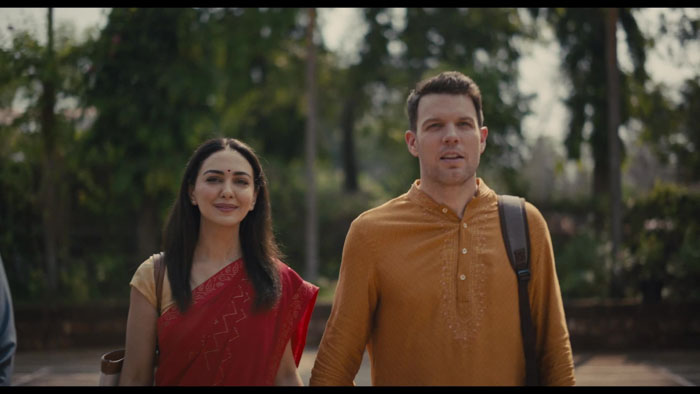 Andrew and Daniela walk together in India in A Mosquito in the Ear (2026).