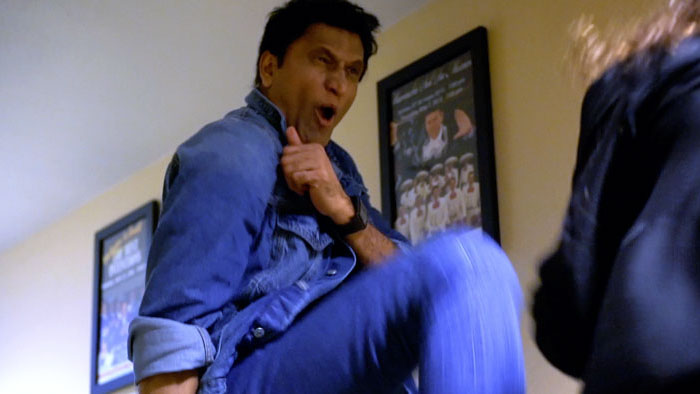 a high kick during a fight scene in the action film Bullets Blades and Blood (2026)