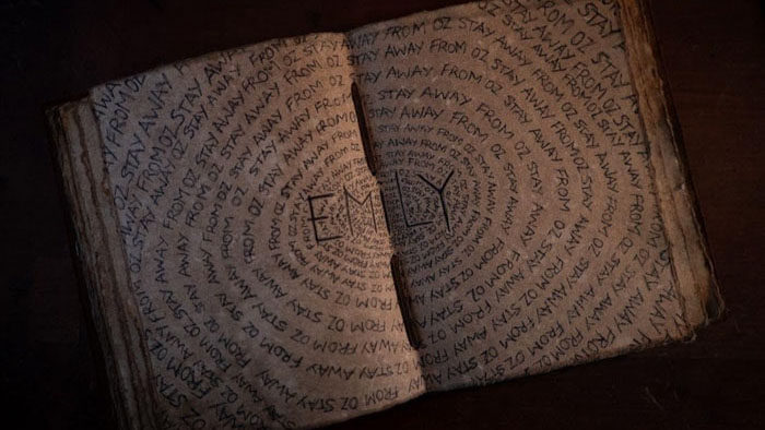 Sketchbook page repeating the phrase Stay Away From Oz in Gale Yellow Brick Road