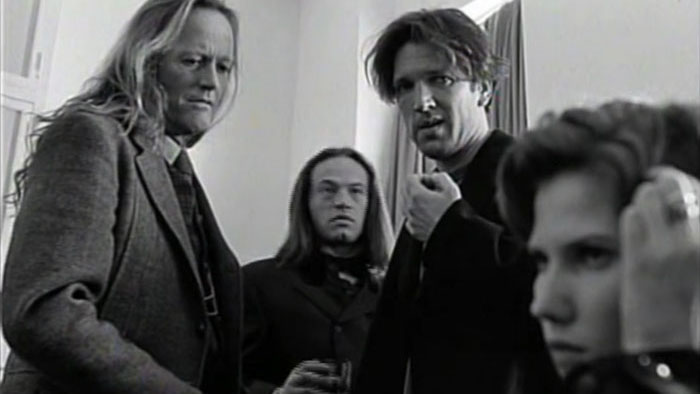 Dr. Van Helsing (Peter Fonda), Edgar (Jared Harris), and Jim (Martin Donovan) in a tense black-and-white scene from Nadja.