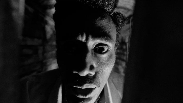 Extreme close-up of Tony in a dark, intense moment from Tony Odyssey (2026).