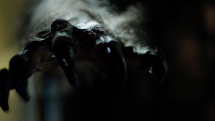 Close-up of a werewolf claw with steam rising in Big Bad (2026)