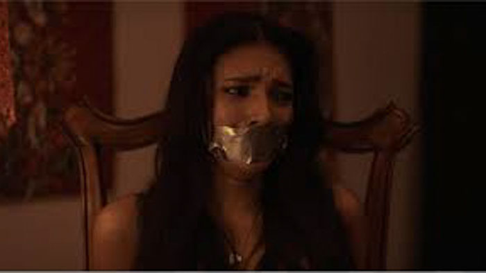 Kat Van Owen (Christina Colgan) bound and gagged in Kat Crime: Tales of the Occult.