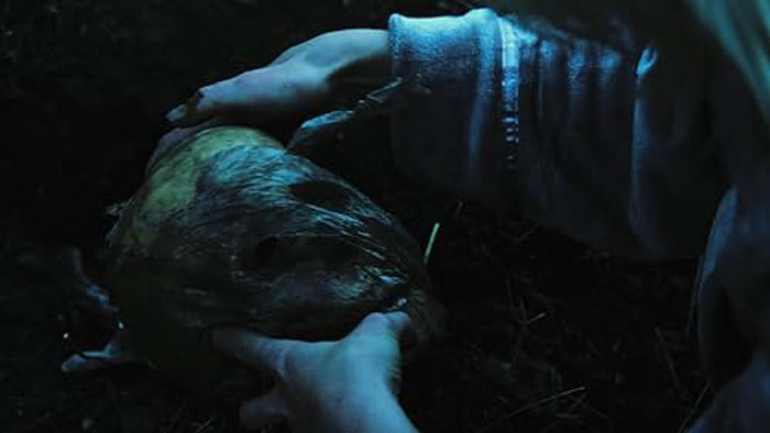 A character holds an urn containing Sylvia’s ashes in Lady in the Urn.