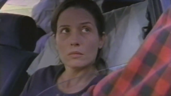 A woman sits inside a car in Like Normal People.