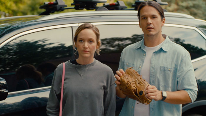 Sophie Whitaker (Kelley Jakle) and Alan Rhodes (Mark Hapka) stand outside in Premarital.