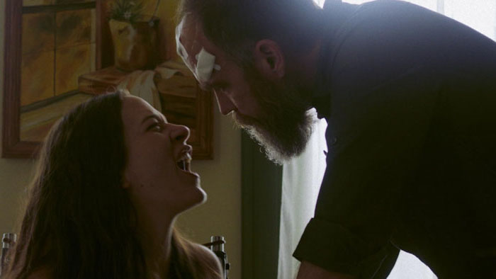 Dani (Kelsey Christian) faces Virgil (Michael Gmur) in a tense confrontation in Straight On Till Morning.