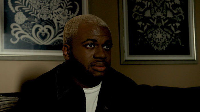 Malcolm Green in a tense scene from The Burden of Grace (2026)