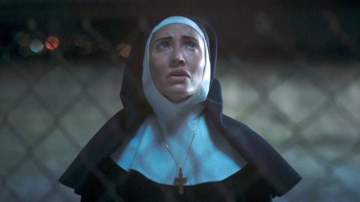 Sister Esperanza (Fernanda Romero) looks upward in The Containment.