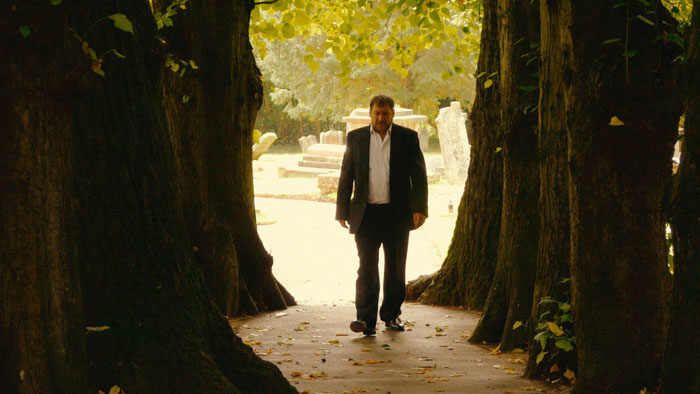 Jim Baitte (Jack Redmayne) walks between towering trees in The Peril at Pincer Point.