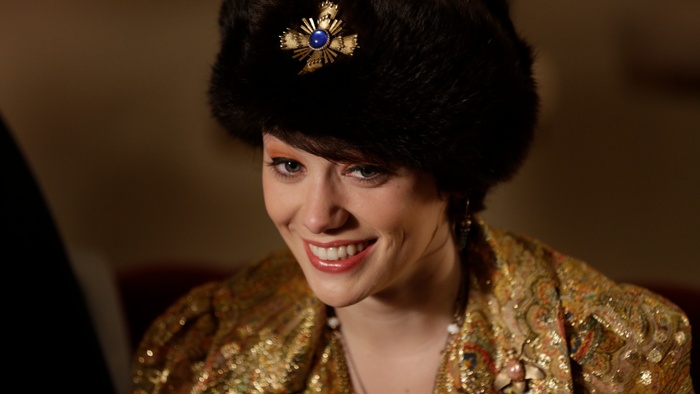 Ellie (Lucy Loken) in A Blind Bargain wearing an ornate outfit and fur hat.