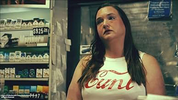Jill (Jolee Holder) standing inside a store in Clown 2.