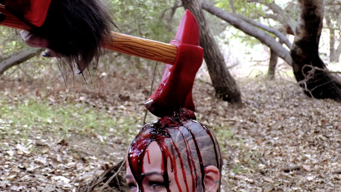 A bloody axe is lodged in a victim’s head in Man-O-Wolf: The Axe Wielding Werewolf from Hell.