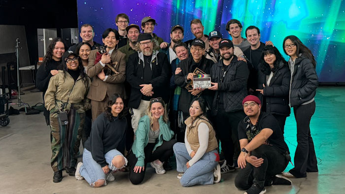 The cast and crew of Reunion pose together on set in Los Angeles