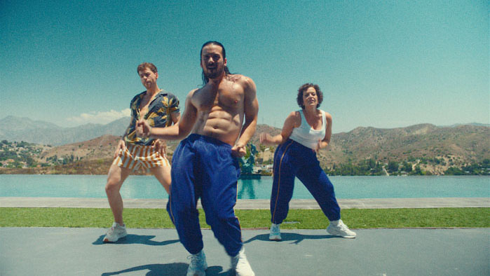 Brian (Lou Taylor Pucci), Craig (Jordan Gavaris), and Joey (Olivia Taylor Dudley) dancing by the water in Touch Me.