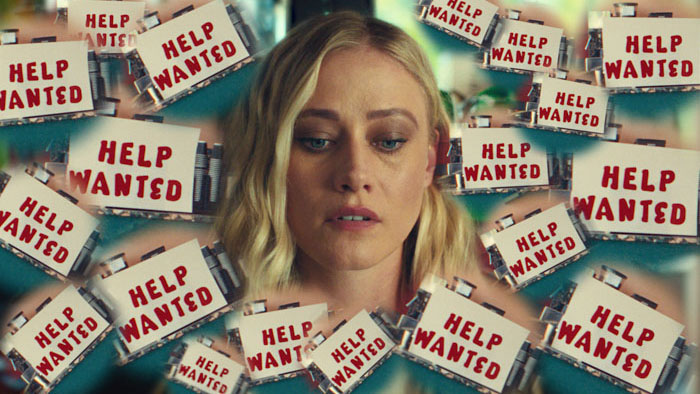 Joey (Olivia Taylor Dudley) surrounded by Help Wanted signs in Touch Me.